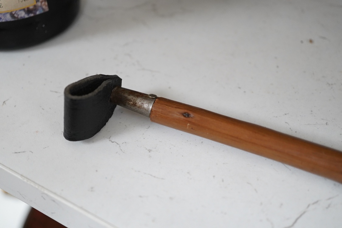 A Victorian electroplate mounted memorial horse hoof inkwell, 11cm high and a white metal mounted riding crop